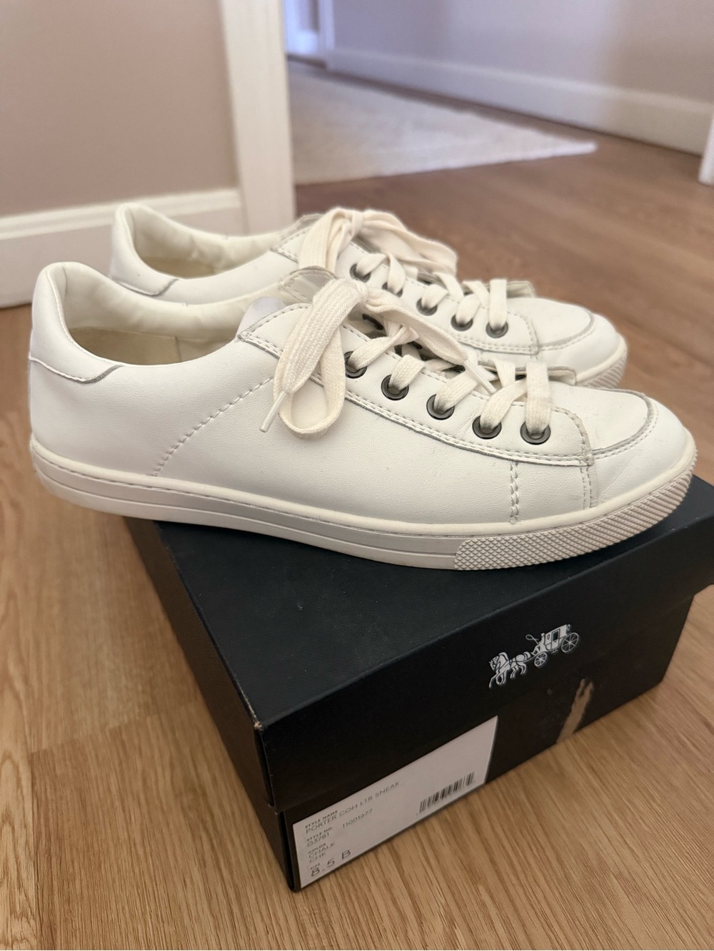 Coach Porter white leather low top sneakers.